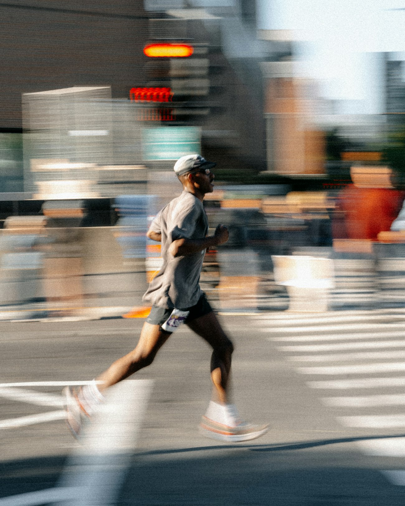 A runner climbing a flight of concrete city stairs